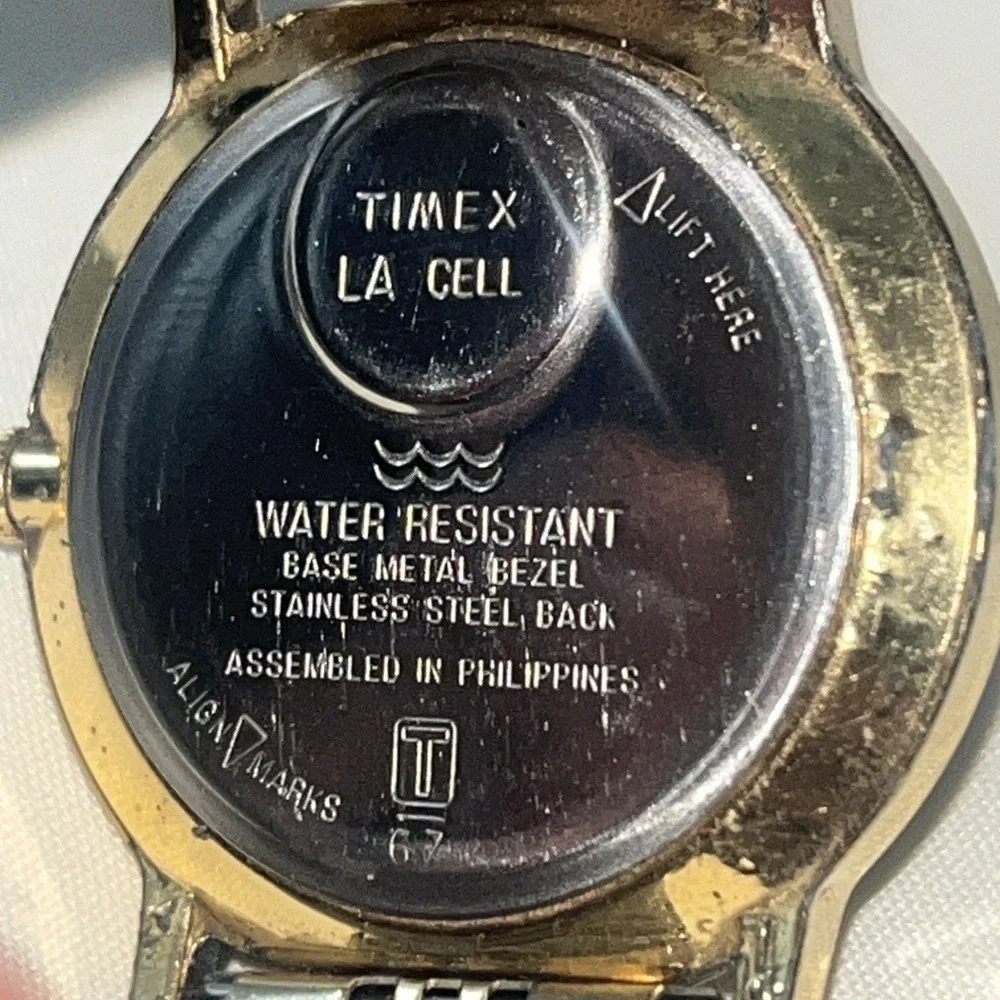 Vintage Gold Band Timex Watch. LA CELL. White Face. Metal Band. Needs Battery‎